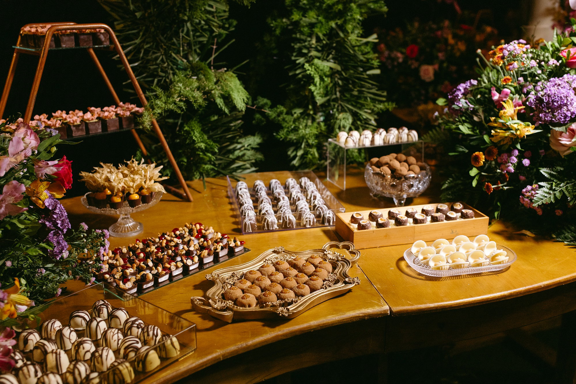 a-wooden-table-topped-with-lots-of-desserts.jpg A wooden table topped with lots of desserts